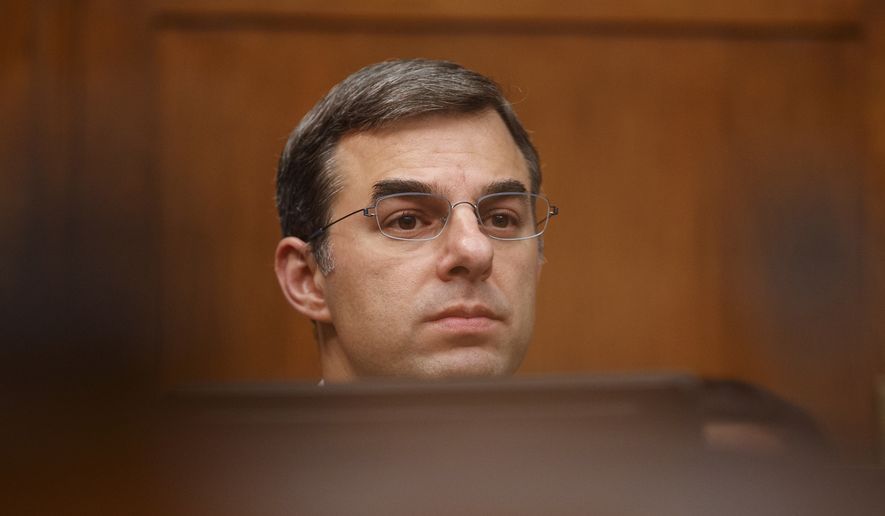 House Oversight and Reform National Security subcommittee member Rep. Justin Amash, R-Mich., looks out from the dais on Capitol Hill in Washington, Wednesday, May 22, 2019, during the House Oversight and Reform National Security subcommittee hearing on &quot;Securing U.S. Election Infrastructure and Protecting Political Discourse.&quot; (AP Photo/Carolyn Kaster)