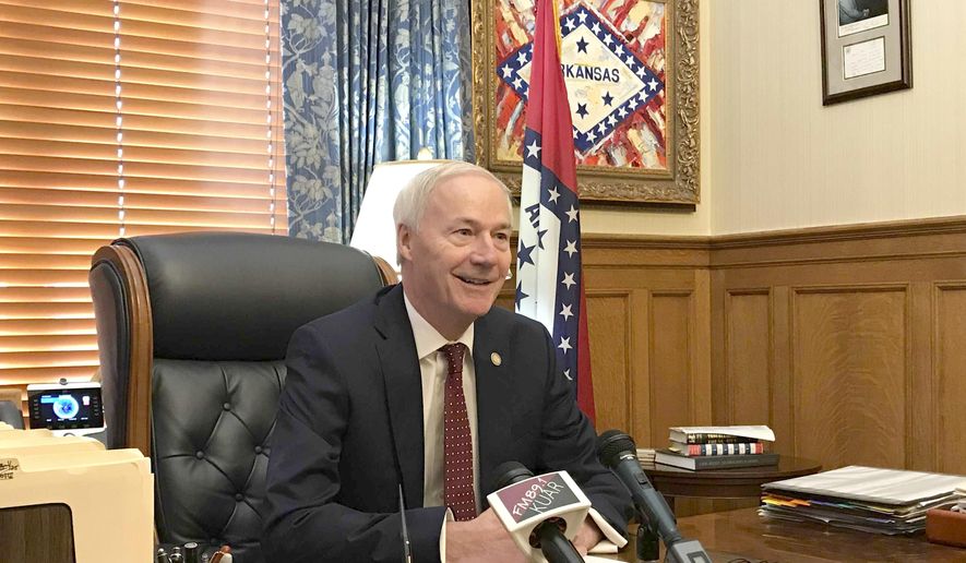 Arkansas Gov. Asa Hutchinson talks to reporters at the state Capitol in Little Rock, Arkansas, Wednesday, May 22, 2019 about the 15 cabinet secretaries he's named under a government reorganization plan. Hutchinson said the new secretaries will begin work July under the reorganization plan that lawmakers approved earlier this year, calling the plan the largest government reorganization in Arkansas in nearly 50 years.(AP Photo/Andrew DeMillo)