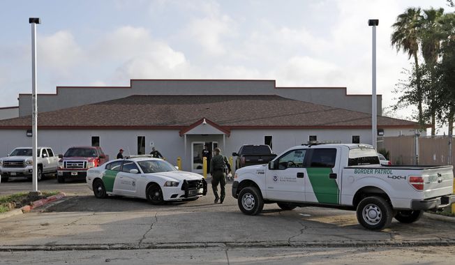 FILE - In this June 23, 2018 file photo, a U.S. Border Patrol Agent walks between vehicles outside the Central Processing Center in McAllen, Texas. U.S. border agents have temporarily closed their primary facility for processing migrants in South Texas one day after authorities say a 16-year-old died after being diagnosed with the flu at the facility. In a statement released late Tuesday, May 21, 2019, U.S. Customs and Border Protection said it would stop detaining migrants at the processing center in McAllen, Texas. CBP says &amp;quot;a large number&amp;quot; of people in custody were found Tuesday to have high fevers.  (AP Photo/David J. Phillip, File)