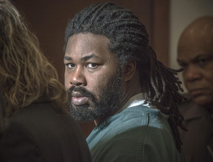 FILE - In this Nov. 14, 2014 file photo Jesse Matthew Jr. looks toward the gallery while appearing in court in Fairfax, Va. Matthew, who abducted and killed two Virginia college students five years apart, was transferred to a new prison this week so he can receive medical treatment for cancer. He is serving multiple life sentences for the 2009 murder of Virginia Tech student Morgan Harrington and the 2014 murder of University of Virginia student Hannah Graham. He pleaded guilty in 2016 to both killings. A spokeswoman for the Virginia Department of Corrections confirmed that Matthew was transferred Monday, May 20, 2019, from the Red Onion State Prison in Wise County to Sussex I State Prison. (Bill O'Leary/The Washington Post via AP, Pool, File)