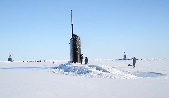 The Seawolf-class fast-attack submarine USS Connecticut (SSN 22), left, Los Angeles-class fast-attack submarine USS Hartford (SSN 768), center, and the Royal Navy hunter killer submarine, HMS Trenchant (S-91) surface through the ice during the multinational maritime Ice Exercise (ICEX) in the Arctic Circle. ICEX 2018 is a five-week exercise that allows the Navy to assess its operational readiness in the Arctic, increase experience in the region, advance understanding of the Arctic environment, and continue to develop relationships with other services, allies and partner organizations. (U.S. Navy photo by Chief Mass Communication Specialist  Darryl I. Wood/Released) ** FILE **
