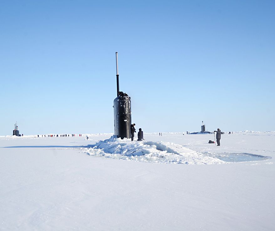 The Seawolf-class fast-attack submarine USS Connecticut (SSN 22), left, Los Angeles-class fast-attack submarine USS Hartford (SSN 768), center, and the Royal Navy hunter killer submarine, HMS Trenchant (S-91) surface through the ice during the multinational maritime Ice Exercise (ICEX) in the Arctic Circle. ICEX 2018 is a five-week exercise that allows the Navy to assess its operational readiness in the Arctic, increase experience in the region, advance understanding of the Arctic environment, and continue to develop relationships with other services, allies and partner organizations. (U.S. Navy photo by Chief Mass Communication Specialist Darryl I. Wood/Released) ** FILE **