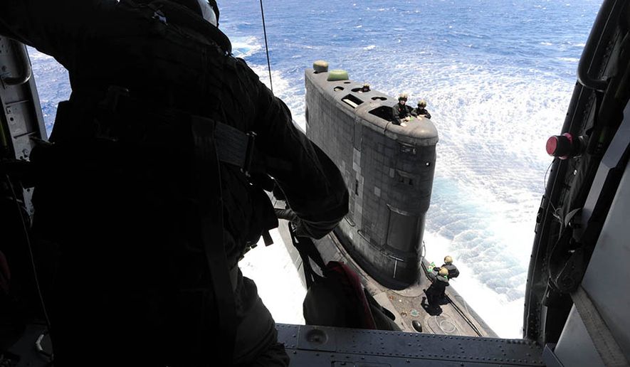 Naval Aircrewman 2nd Class Dusty Bartell, assigned to Helicopter Sea Combat Squadron (HSC) 4, maintains control of a hoist cable while lowering priority repair parts to the Royal Navy submarine HMCS Victoria (SSK 876) during a Rim of the Pacific (RIMPAC) 2012 exercise. Twenty-two nations, more than 40 ships and submarines, more than 200 aircraft and 25,000 personnel are participating in the biennial Rim of the Pacific (RIMPAC) exercise from June 29 to Aug. 3, in and around the Hawaiian Islands. The world's largest international maritime exercise, RIMPAC provides a unique training opportunity that helps participants foster and sustain the cooperative relationships that are critical to ensuring the safety of sea lanes and security on the world's oceans. RIMPAC 2012 is the 23rd exercise in the series that began in 1971. (U.S. Navy photo by Mass Communication Specialist 2nd Class Derek R. Sanchez/Released)