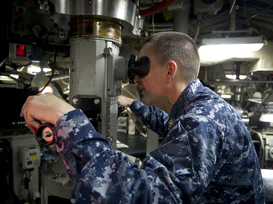 Master Chief Petty Officer of the Navy (MCPON) Michael D. Stevens looks through the periscope of the Ohio-class ballistic-missile submarine USS Louisiana (SSBN 743) during a visit to Naval Base Kitsap-Bangor. Stevens talked with Sailors, Marines, and civilian employees throughout the base during his visit. (U.S. Navy photo by Mass Communication Specialist 2nd Class Thomas L. Rosprim/Released)