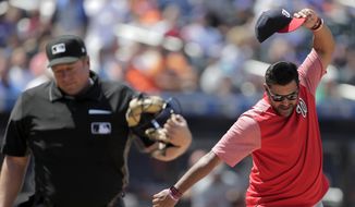 Washington Nationals manager Dave Martinez, right, reacts after being ejected by home plate umpire Bruce Dreckman for arguing after Nationals&#39; Howie Kendrick was called out on strikes during the eighth inning of a baseball game against the New York Mets, Thursday, May 23, 2019, in New York. (AP Photo/Julio Cortez)