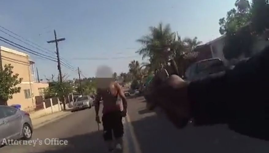 Officer Corey Pitts defends himself during an August 2018 confronation with Vaughn Denham. The chain-wielding suspect was warned over 20 times that he would be shot if he did not comply with lawful orders to drop the chain and lay on the ground. (Image: San Diego District Attorney's Office)