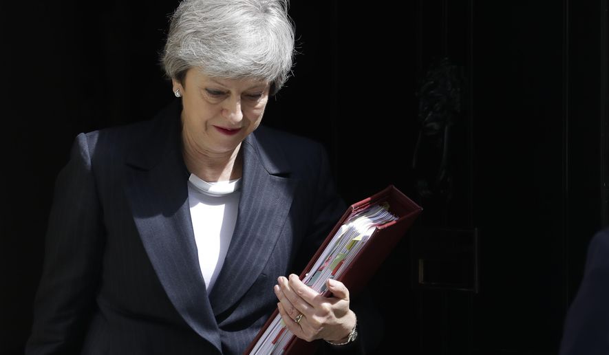 Britain&#39;s Prime Minister Theresa May leaves 10 Downing Street to attend the weekly session of Prime Ministers Questions in Parliament in London, Wednesday, May 22, 2019. (AP Photo/Kirsty Wigglesworth)