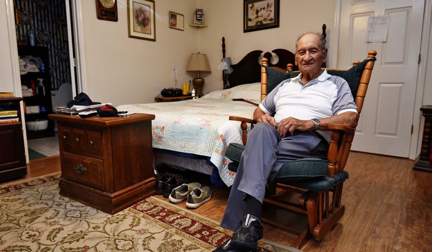 In this May, 21, 2019, photo, Dennis Trudeau, a World War II veteran who landed in Normandy on D-Day, poses for a photo at his home in Grovetown, Ga. Trudeau had joined the Canadian military at 17 and became a paratrooper in part because they paid an extra $50 a month. (AP Photo/Richard Shiro)