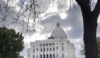 The sun breaks through the clouds over the Minnesota Capitol in St. Paul, Minn., Thursday, May 23, 2019. Gov. Tim Walz and top legislative leaders reached agreement Thursday on the last of their major budget bills, leaving lawmakers waiting on the governor to call a special session to finish their work for the year.  (AP Photo/Steve Karnowski)