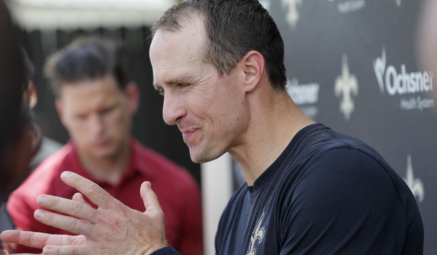 New Orleans Saints quarterback Drew Brees talks to reporters after NFL football practice in Metairie, La., Thursday, May 23, 2019. (AP Photo/Gerald Herbert)