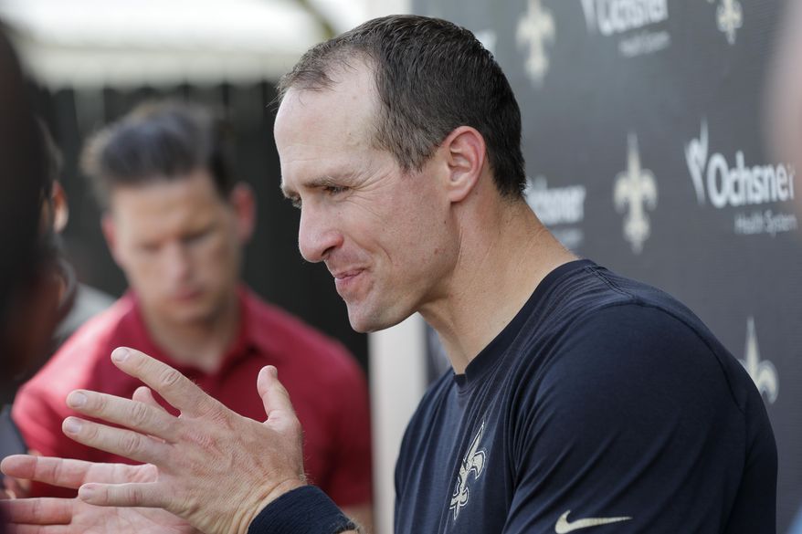 New Orleans Saints quarterback Drew Brees talks to reporters after NFL football practice in Metairie, La., Thursday, May 23, 2019. (AP Photo/Gerald Herbert)