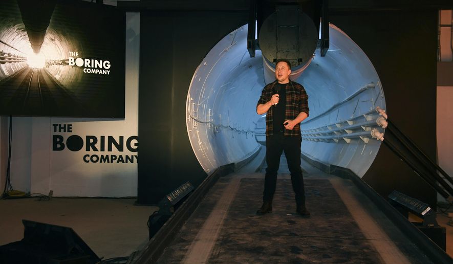 In this Dec. 18, 2018 file photo Elon Musk, co-founder and chief executive officer of Tesla Inc., speaks during an unveiling event for the Boring Co. Hawthorne test tunnel in Hawthorne, Calif. The Boring Company, backed by tech billionaire Musk has been granted a nearly $49 million contract to build a transit system using self-driving vehicles underneath the Las Vegas Convention Center. (Robyn Beck/Pool Photo via AP, File)
