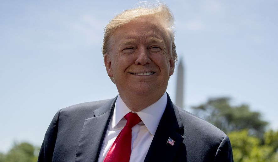 President Donald Trump smiles while speaking to members of the media on the South Lawn of the White House in Washington, Friday, May 24, 2019, before boarding Marine One for a short trip to Andrews Air Force Base, Md, and then on to Tokyo. (AP Photo/Andrew Harnik)