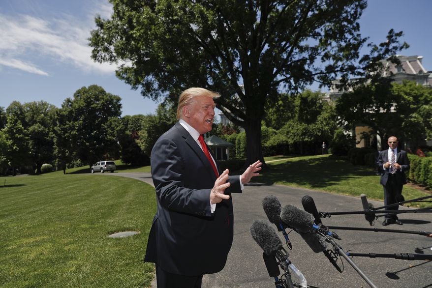 President Donald Trump speaks to members of the media on the South Lawn of the White House in Washington, Friday, May 24, 2019, before boarding Marine One for a short trip to Andrews Air Force Base, Md., and then on to Tokyo, Japan. (AP Photo/Pablo Martinez Monsivais)