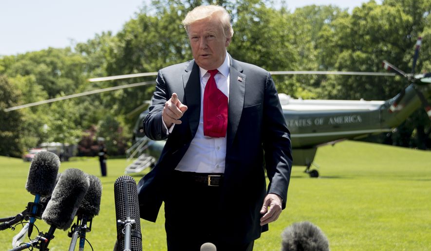 President Donald Trump speaks to members of the media on the South Lawn of the White House in Washington, Friday, May 24, 2019, before boarding Marine One for a short trip to Andrews Air Force Base, Md., and then on to Tokyo. (AP Photo/Andrew Harnik)