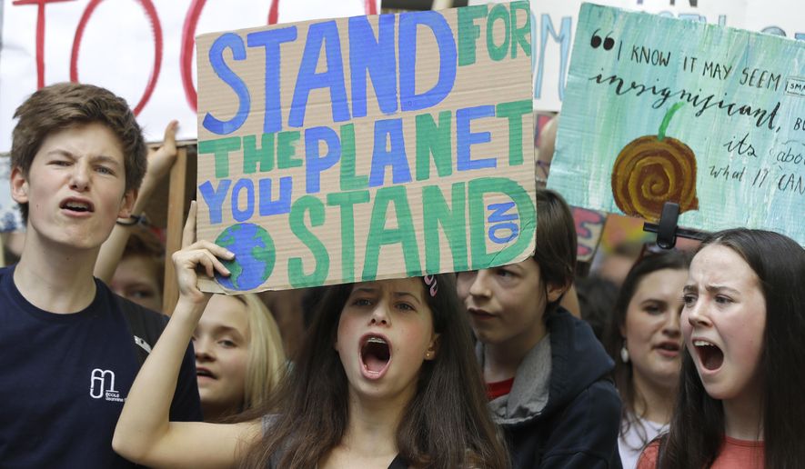 Young demonstrators take part in a demonstration organised by 'Global Strike 4 Climate' near Parliament in London, Friday, May 24, 2019. (AP Photo/Kirsty Wigglesworth)