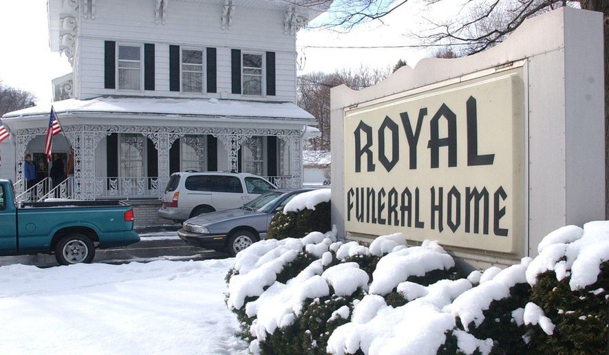 In this 1999 photo, Royal Funeral Home in Battle Creek, Mich., is shown. The Royal Funeral Home, a Battle Creek business for 83 years, has been ordered to close by the state of Michigan. The Department of Licensing and Regulatory Affairs has suspended the licenses of the funeral home and of owner Richard 'Rick' Royal effective May 28, 2019 because of irregularities in prepaid funeral contracts. (Kevin Hare/The Enquirer via AP)