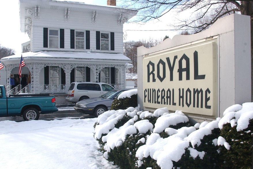In this 1999 photo, Royal Funeral Home in Battle Creek, Mich., is shown. The Royal Funeral Home, a Battle Creek business for 83 years, has been ordered to close by the state of Michigan. The Department of Licensing and Regulatory Affairs has suspended the licenses of the funeral home and of owner Richard 'Rick' Royal effective May 28, 2019 because of irregularities in prepaid funeral contracts. (Kevin Hare/The Enquirer via AP)