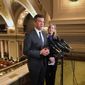 Democratic Minnesota House Majority Leader Ryan Winkler, left, and Democratic House Speaker Melissa Hortman, right, speak to reporters above the House chamber in the state Capitol in St. Paul, Minn. on the opening day of a special session to finish work on the state&#39;s $48 billion two-year budget, Friday, May 24, 2019. (AP Photo/Steve Karnowski)