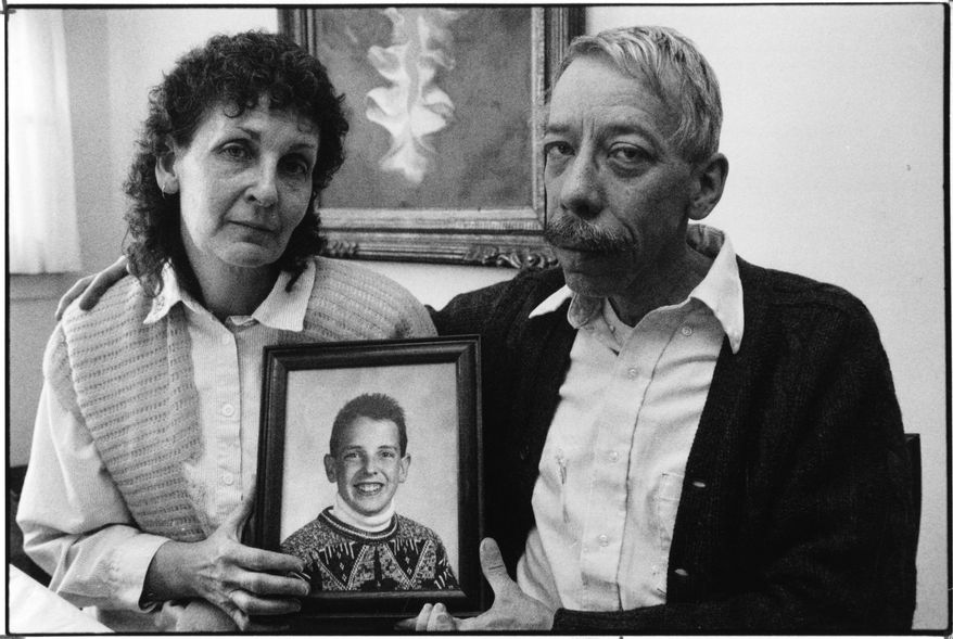 In this Jan. 7, 1992 photo, Esther and Allan Chereck, parents of slain David Chereck, hold a photo of their son during an interview at their home in Skokie, Ill. on Jan. 7, 1992. Eduardo Contreras, Robert Serritella was found guilty Thursday, May 23, 2019 of first-degree murder in the 1992 death of 15-year-old David Chereck. Serritella, 76, of Park Ridge, was charged in 2014 in the decades-old cold case. Chereck was found strangled with his own scarf in a Morton Grove forest preserve. (Eduardo Contreras/Chicago Tribune via AP)