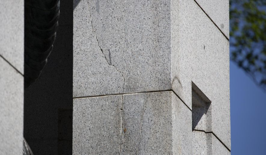 A crack is seen in Atlantic granite arch at the World War II Memorial on the National Mall in Washington, Friday, May 24, 2019. (AP Photo/Carolyn Kaster)
