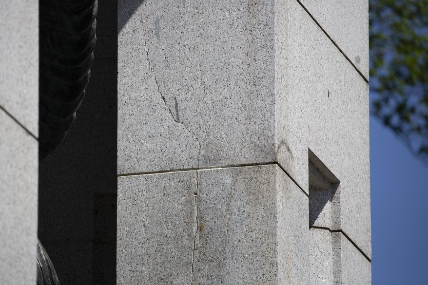 A crack is seen in Atlantic granite arch at the World War II Memorial on the National Mall in Washington, Friday, May 24, 2019. (AP Photo/Carolyn Kaster)