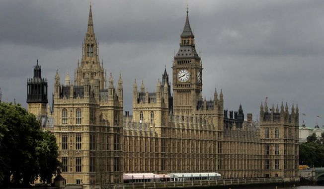 This Thursday, July 26, 2007, file photo shows a general view of the Houses of Parliament on the river Thames in London. (AP Photo/Kirsty Wigglesworth, File)