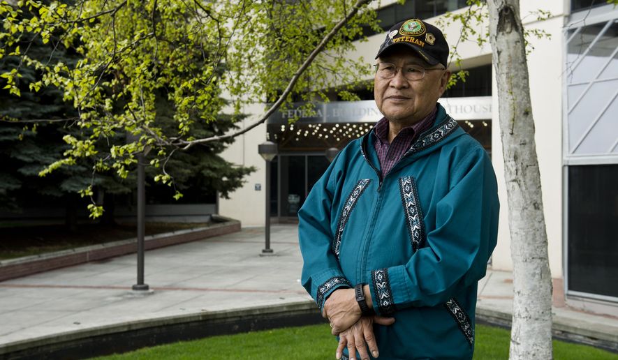 In this photo taken May 6, 2019, is Nelson Angapak standing outside the Federal Building in Anchorage, Alaska. Angapak is advocating for land allotments for Alaska Native veterans who were serving in Vietnam when the allotment program ended in 1971. Congress in March passed a major lands bill that opens the door for more Native veterans to apply for tracts of land of up to 160 acres. It follows a more limited application period in 1998, an opportunity that many veterans said wasn&#x27;t enough. (Marc Lester/Anchorage Daily News via AP)