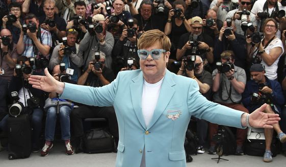 In this Thursday, May 16, 2019, file photo, singer Elton John poses for photographers at the photo call for the film "Rocketman" at the 72nd international film festival, Cannes, southern France. (Photo by Joel C Ryan/Invision/AP) ** FILE **