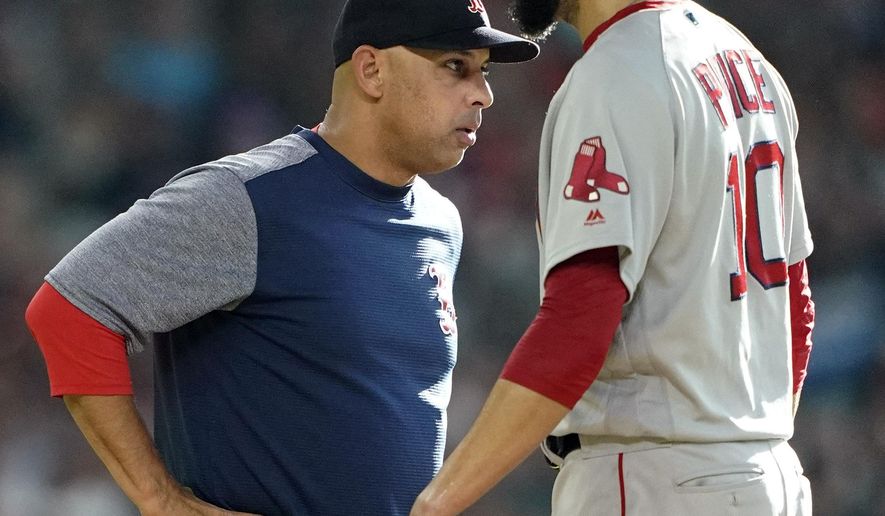 Boston Red Sox manager Alex Cora, left, talks with starting pitcher David Price before making a pitching change during the first inning of a baseball against the Houston Astros game Saturday, May 25, 2019, in Houston. (AP Photo/David J. Phillip)