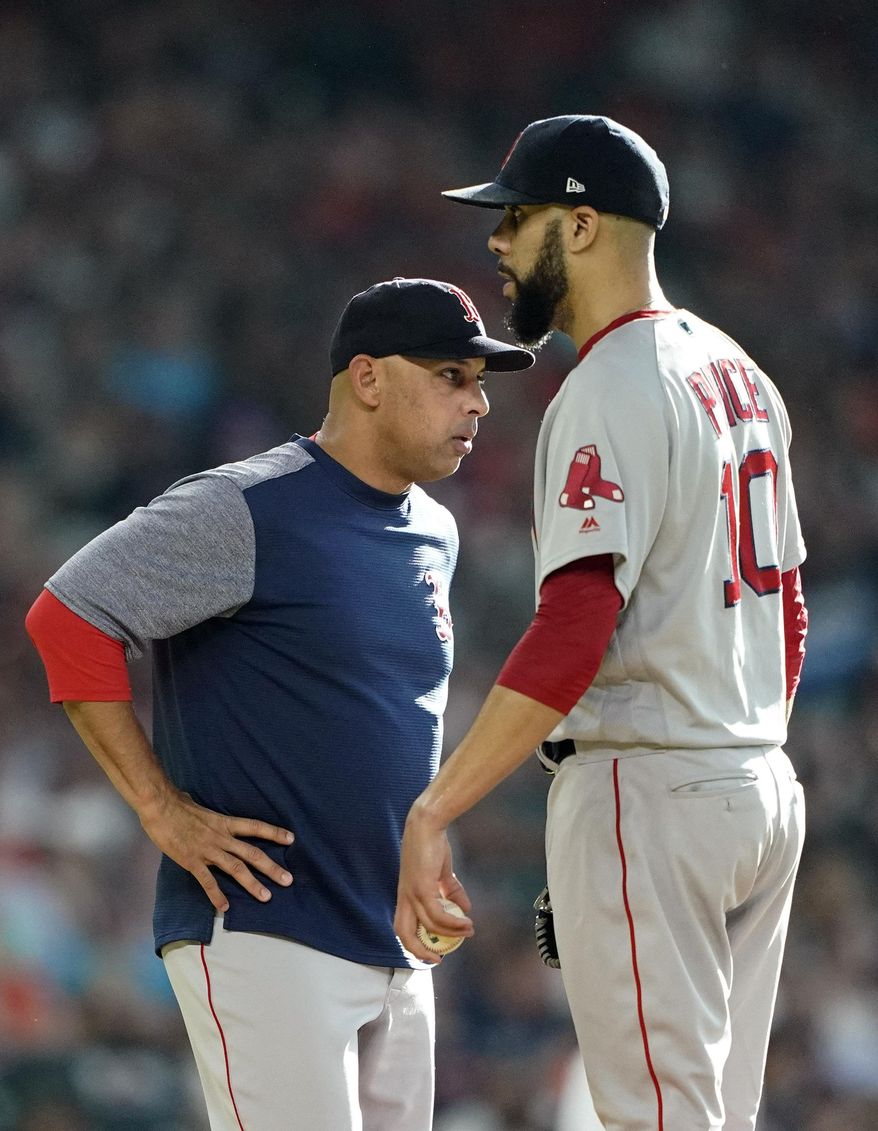 Boston Red Sox manager Alex Cora, left, talks with starting pitcher David Price before making a pitching change during the first inning of a baseball against the Houston Astros game Saturday, May 25, 2019, in Houston. (AP Photo/David J. Phillip)