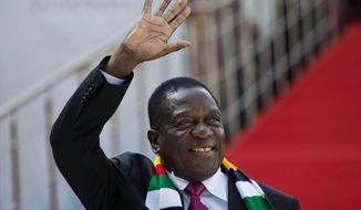 Zimbabwean President Emmerson Mnangagwa arrives for the swearing-in ceremony of Cyril Ramaphosa at Loftus Versfeld stadium in Pretoria, South Africa, Saturday May 25, 2019. Ramaphosa has vowed to crack down on the corruption that contributed to the ruling ANC&#39; s weakest election showing in a quarter-century. (AP Photo/Jerome Delay)