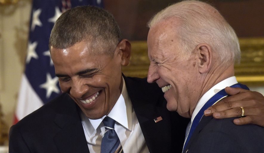 President Barack Obama laughs with Vice President Joe Biden during a ceremony in the State Dining Room of the White House in Washington, Thursday, Jan. 12, 2017. Obama presented Biden with the Presidential Medal of Freedom. (AP Photo/Susan Walsh)