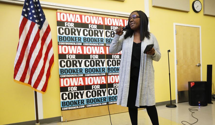 Former chairwoman of the Iowa Democratic Black Caucus, Jamie Woods, introduces Democratic presidential candidate Sen. Cory Booker to speak during the Iowa Democratic Party Black Caucus Reception, Tuesday, April 16, 2019, in Des Moines, Iowa. (AP Photo/Charlie Neibergall) ** FILE **