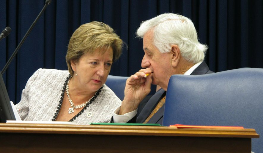 Sen. Sharon Hewitt, R-Slidell, left, speaks with Senate President John Alario, R-Westwego, during a meeting of the Senate Finance Committee, on Monday, May 27, 2019, in Baton Rouge, La. The committee was working on a package of budget bills for next year. (AP Photo/Melinda Deslatte)