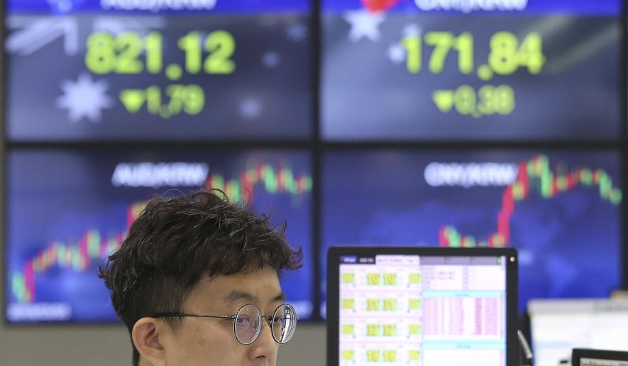 A currency trader watches monitors at the foreign exchange dealing room of the KEB Hana Bank headquarters in Seoul, South Korea, Monday, May 27, 2019. Shares were mixed early Monday in Asia in the absence of fresh news on the tariffs standoff between the U.S. and China. (AP Photo/Ahn Young-joon)