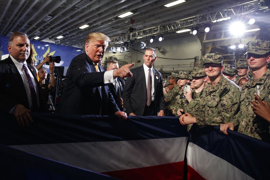 U.S. President Donald Trump talks with troops at a Memorial Day event aboard the USS Wasp amphibious assault ship, Tuesday, May 28, 2019, in Yokosuka, Japan. (AP Photo/Evan Vucci)