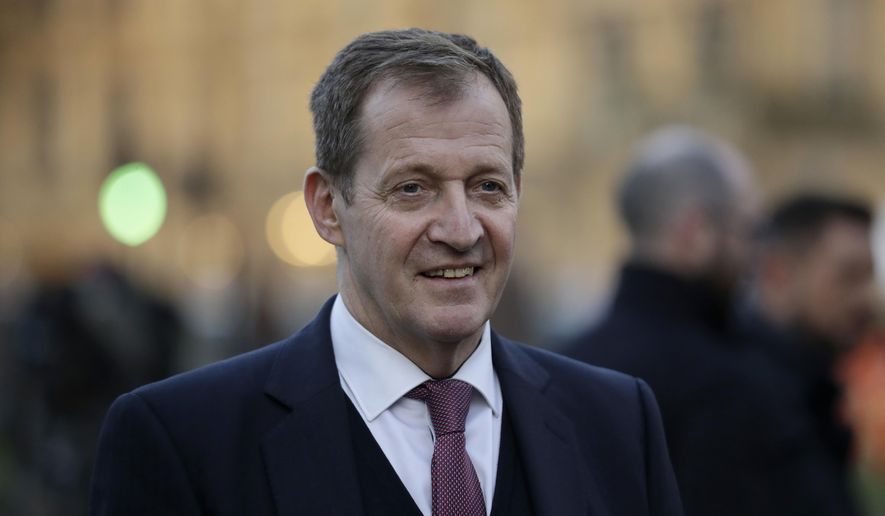 FILE - In this Tuesday, Dec. 11, 2018 file photo, Alastair Campbell, the former director of communications and strategy for former British Prime Minister Tony Blair stands on College Green near the Houses of Parliament, in London. One of the best-known figures in Britain’s Labour Party for the last 20 years, Alastair Campbell, says he has been expelled for backing another party in last week’s European election. Campbell became a famous figure as the pugnacious spin doctor to then-Prime Minister Tony Blair between 1997 and 2003. He has criticized the party’s lurch to the left under current leader Jeremy Corbyn and its failure to firmly back a new Brexit referendum. (AP Photo/Matt Dunham, File)