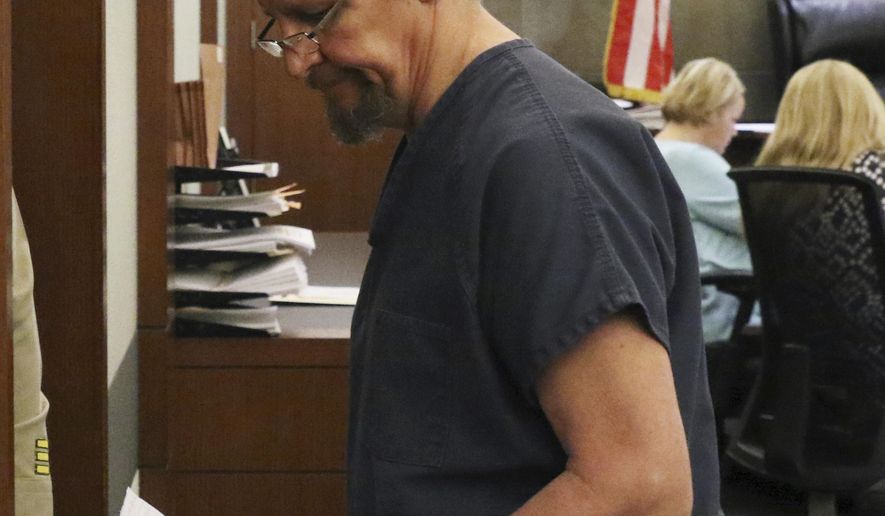 Christopher Sena, convicted of videotaping sex acts with children, is lead out of the courtroom after his sentencing at the Regional Justice Center on Tuesday, May 28, 2019, in Las Vegas. Sena was sentenced to 54 life prison sentences. (Bizuayehu Tesfaye/Las Vegas Review-Journal via AP)