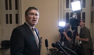 Rep. Thomas Massie, R-Ky., speaks to reporters at the Capitol after he blocked a unanimous consent vote on a long-awaited $19 billion disaster aid bill in the chamber on Tuesday, May 28, 2019. (AP Photo/J. Scott Applewhite) ** FILE **