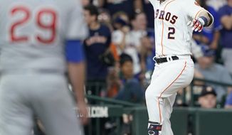 Houston Astros&#39; Alex Bregman (2) celebrates after hitting a two-run home run off Chicago Cubs relief pitcher Brad Brach (29) during the sixth inning of a baseball game Tuesday, May 28, 2019, in Houston. (AP Photo/David J. Phillip)