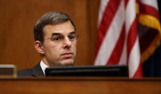 House Oversight and Reform National Security subcommittee member Rep. Justin Amash, R-Mich., looks out from the dais on Capitol Hill in Washington, Wednesday, May 22, 2019, during the House Oversight and Reform National Security subcommittee hearing on &amp;quot;Securing U.S. Election Infrastructure and Protecting Political Discourse.&amp;quot; (AP Photo/Carolyn Kaster)
