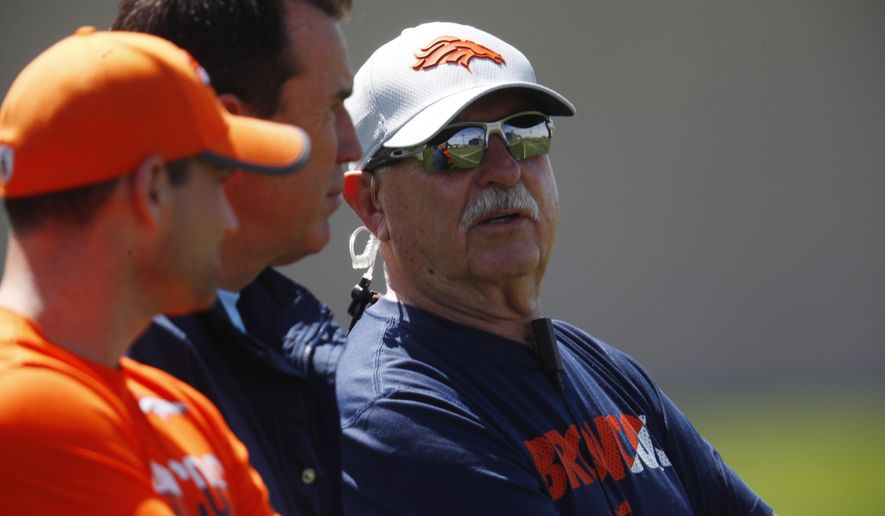 FILE - In this Tuesday, May 22, 2018, file photo, Denver Broncos head trainer Steve Antonopulos looks on as players work out during an NFL football minicamp session at the team's headquarters in Englewood, Colo. The Broncos announced Tuesday, May 28, 2019, that Antonopulos will be presenting team owner Pat Bowlen during his NFL Hall of Fame induction ceremony this summer. (AP Photo/David Zalubowski, File)
