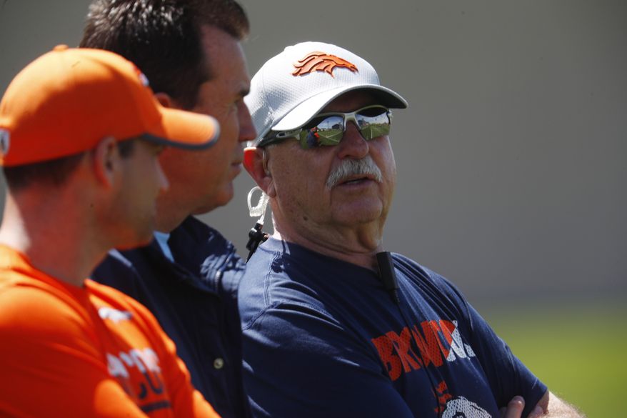 FILE - In this Tuesday, May 22, 2018, file photo, Denver Broncos head trainer Steve Antonopulos looks on as players work out during an NFL football minicamp session at the team's headquarters in Englewood, Colo. The Broncos announced Tuesday, May 28, 2019, that Antonopulos will be presenting team owner Pat Bowlen during his NFL Hall of Fame induction ceremony this summer. (AP Photo/David Zalubowski, File)