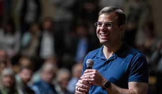 U.S. Rep. Justin Amash, R-Cascade Township, holds a town hall meeting at Grand Rapids Christian High School&#x27;s DeVos Center for Arts and Worship on Tuesday, May 28, 2019. The congressman came under scrutiny May 18 when he posted a series of tweets to outline his support for impeachment proceedings. As such, he is the only Republican congress member to do so. The following days brought an announcement from the wealthy DeVos family about no longer supporting him financially. (Cory Morse/The Grand Rapids Press via AP)