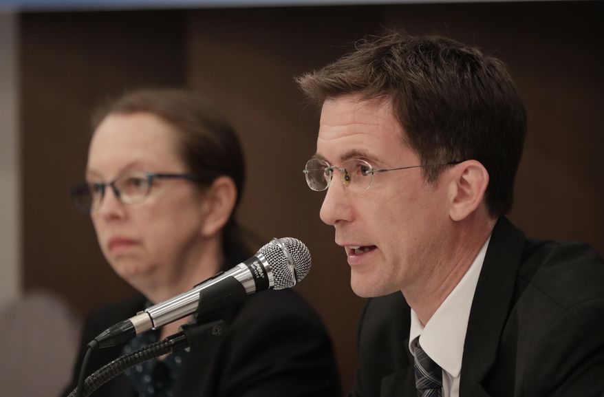 Human rights officer Daniel Collinge, right, speaks as representative of OHCHR in Seoul or Office of the United Nations High Commissioner for Human Rights in Seoul, Signe Poulsen, left, listens during a press conference in Seoul, South Korea, Tuesday, May 28, 2019. North Koreans working in hundreds of thriving markets that sprung up with the failure of the country's public system for distributing basic goods are often abused and forced to resort to bribery to survive, according to a U.N. report released Tuesday. (AP Photo/Lee Jin-man)