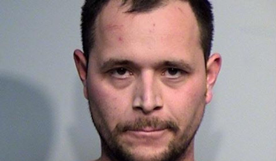 This photo provided by the Yavapai County Sheriff's Office shows 29-year-old John Felipe Jaimes of Las Vegas, Nevada. Authorities say Jaimes led police on a 60-mile chase in central Arizona and jumped out of an SUV just before it went over a cliff and into a canyon. Jaimes, who is suspected to have stolen the vehicle, was later found hiding on a tree on the canyon's rim. (Yavapai County Sheriff's Office via AP)