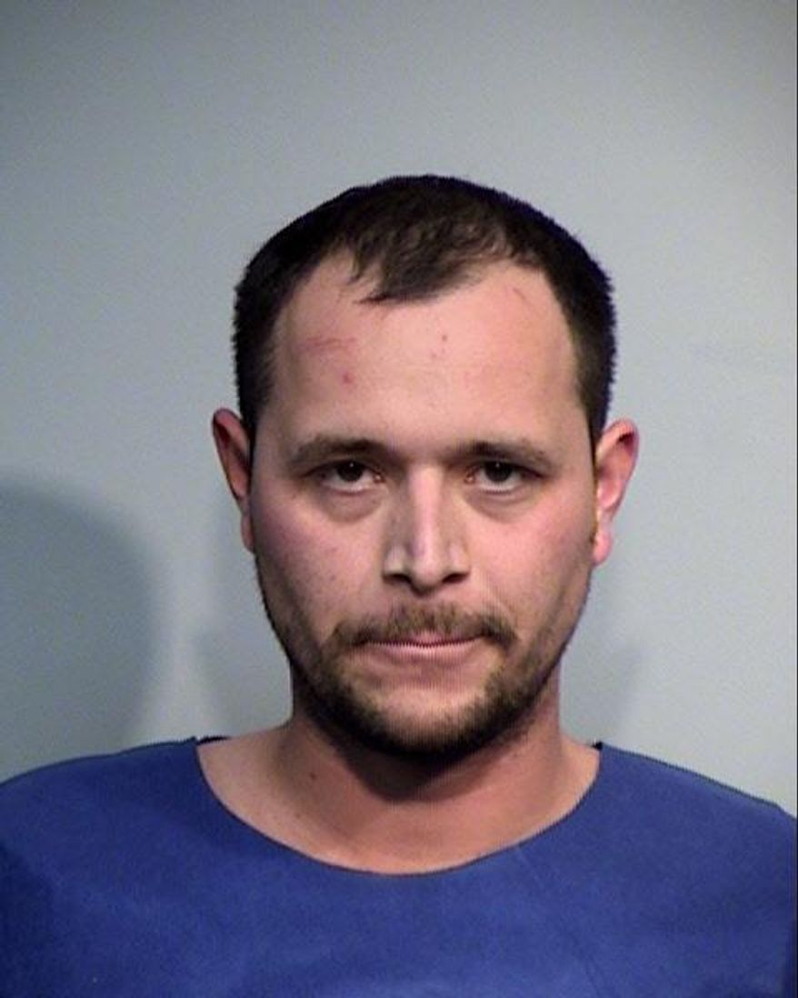 This photo provided by the Yavapai County Sheriff's Office shows 29-year-old John Felipe Jaimes of Las Vegas, Nevada. Authorities say Jaimes led police on a 60-mile chase in central Arizona and jumped out of an SUV just before it went over a cliff and into a canyon. Jaimes, who is suspected to have stolen the vehicle, was later found hiding on a tree on the canyon's rim. (Yavapai County Sheriff's Office via AP)