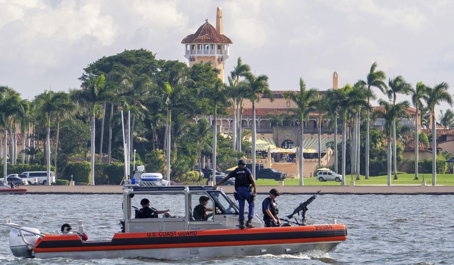 FILE - In this Nov. 22, 2018 file photo, a U.S. Coast Guard patrol boat passes President Donald Trump&#39;s Mar-a-Lago estate in Palm Beach, Fla. University of Wisconsin student Mark Lindblom has pleaded guilty to sneaking into Mar-a-Lago last fall during one of President Donald Trump’s visits to his Florida club. Lindblom apologized Tuesday, May 28, 2019 and received a year’s probation after prosecutors agreed he meant no harm.  (AP Photo/J. David Ake, File)