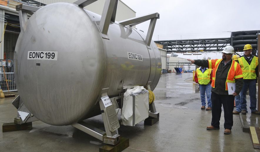 In this Oct. 27, 2015 file photo, Jeff Brubaker, site manager at the Blue Grass Chemical Agent Destruction Pilot Plant, points to a cylinder that will be used to moved deadly chemical weapons from storage to a new facility where they will be destroyed in Richmond, Ky. Senate Majority Leader Mitch McConnell, military leaders and Gov. Matt Bevin were in Richmond on Wednesday, May 29, 2019, to ceremonially mark the beginning of the elimination of more than 500 tons of mustard gas, sarin or VX agent stored at the Army depot. (AP Photo/Dylan Lovan) **FILE**
